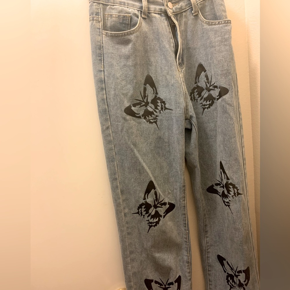 Butterfly Print Faded Denim Jeans